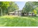 Charming brick and siding home with mature trees and a well-maintained lawn at 12014 Briar Way Center Dr, Indianapolis, IN 46126