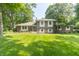 Charming brick and siding home with mature trees and a well-maintained lawn at 12014 Briar Way Center Dr, Indianapolis, IN 46126