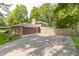 Attached garage with long driveway and backyard, surrounded by a wooden fence at 12014 Briar Way Center Dr, Indianapolis, IN 46126