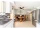 Modern kitchen with stainless steel appliances, white cabinetry, and dining area with a view at 12014 Briar Way Center Dr, Indianapolis, IN 46126