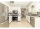 Bright kitchen features stainless steel appliances and white cabinets at 12014 Briar Way Center Dr, Indianapolis, IN 46126