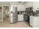 Updated kitchen features stainless appliances and tile floor at 12014 Briar Way Center Dr, Indianapolis, IN 46126