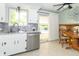 Kitchen with stainless appliances and sliding glass door to backyard and pool at 12014 Briar Way Center Dr, Indianapolis, IN 46126