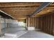 Unfinished basement featuring insulated walls and exposed ceiling beams, offering a large open space at 12338 French Cattle Way, Noblesville, IN 46060
