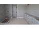 Unfinished bathroom features a tile shower, vanity with storage, and neutral walls at 12338 French Cattle Way, Noblesville, IN 46060
