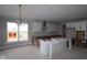 Future kitchen with white cabinets, a large center island, and lots of natural light at 12338 French Cattle Way, Noblesville, IN 46060