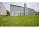 Spacious backyard featuring a well-maintained lawn and siding at 12382 Cool Winds Way, Fishers, IN 46037