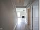 Hallway featuring a fireplace and vinyl flooring at 12382 Cool Winds Way, Fishers, IN 46037