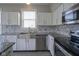 Well lit kitchen featuring stainless steel appliances and a stainless steel sink at 12382 Cool Winds Way, Fishers, IN 46037