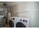 Updated laundry room featuring new washer and dryer and built in shelving at 12382 Cool Winds Way, Fishers, IN 46037