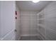 Walk-in pantry with ample shelving for organized storage, and a fire extinguisher for safety at 12382 Cool Winds Way, Fishers, IN 46037