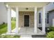 Welcoming front porch adorned with white columns and brickwork, offering a cozy entrance at 12382 Cool Winds Way, Fishers, IN 46037