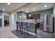 A bar featuring pendant lighting and stainless steel appliances, conveniently located nearby living room at 13429 Boxelder Ct, Carmel, IN 46074
