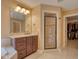 Charming bathroom with tiled shower, vanity, and access to a closet at 13429 Boxelder Ct, Carmel, IN 46074