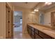 Bathroom with a double vanity and a view of the bedroom at 13429 Boxelder Ct, Carmel, IN 46074