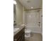 Bathroom featuring a vanity with granite top and a white shower and tub at 13429 Boxelder Ct, Carmel, IN 46074