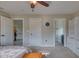 Bedroom with large closet, en-suite bathroom, and hallway access at 13429 Boxelder Ct, Carmel, IN 46074
