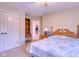 Bedroom with bed, dresser, and bookshelf in view of bedroom entrance at 13429 Boxelder Ct, Carmel, IN 46074