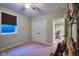 Cozy bedroom with plush carpet, double door closet, and window with a view at 13429 Boxelder Ct, Carmel, IN 46074