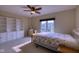 Bright bedroom with built-in shelving and a large window with curb appeal views at 13429 Boxelder Ct, Carmel, IN 46074