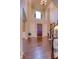 Bright foyer with soaring ceilings, hardwood floors, and elegant chandelier at 13429 Boxelder Ct, Carmel, IN 46074