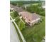 Aerial view of a well-maintained home with manicured lawn, mature trees, and a charming neighborhood setting at 13429 Boxelder Ct, Carmel, IN 46074