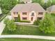 A charming brick home with well-manicured lawn, lush landscaping, stone accents, and a welcoming front entrance at 13429 Boxelder Ct, Carmel, IN 46074