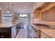 Well-appointed kitchen featuring a large island, stainless steel appliances, and an adjacent breakfast nook at 13429 Boxelder Ct, Carmel, IN 46074