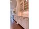 Bright kitchen with granite countertops, custom cabinets, stainless steel appliances, and tile backsplash at 13429 Boxelder Ct, Carmel, IN 46074