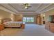 Expansive main bedroom with tray ceiling, large windows and an en-suite bathroom at 13429 Boxelder Ct, Carmel, IN 46074