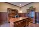 Office featuring wood flooring, wood paneling, and built-in shelving at 13429 Boxelder Ct, Carmel, IN 46074