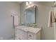 Stylish bathroom featuring a modern vanity with a marble countertop and modern fixtures at 1510 Dominion Dr, Zionsville, IN 46077