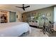 Spacious bedroom boasts a large closet, exercise bike, and a modern ceiling fan at 1510 Dominion Dr, Zionsville, IN 46077