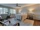 Bright bedroom featuring a queen bed, a ceiling fan, and a window with natural light at 1510 Dominion Dr, Zionsville, IN 46077