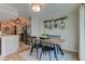 Charming dining area open to the kitchen with a rustic table and accent wall décor at 1510 Dominion Dr, Zionsville, IN 46077