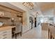 View of updated kitchen with stainless appliances, desk nook, and tile flooring at 1510 Dominion Dr, Zionsville, IN 46077