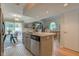 Open kitchen and dining area featuring a kitchen island with stone countertops at 1510 Dominion Dr, Zionsville, IN 46077