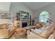 Inviting living room with vaulted ceilings, hardwood floors, and a cozy fireplace at 1510 Dominion Dr, Zionsville, IN 46077