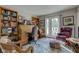 Cozy home office with classic wood furniture, plush chairs, and double doors to the outside at 1510 Dominion Dr, Zionsville, IN 46077