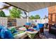 Charming covered patio with comfortable seating and decorative accents, perfect for outdoor relaxation and entertainment at 1510 Dominion Dr, Zionsville, IN 46077