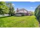 Landscaped backyard with mature trees and fencing at 15515 Alameda Pl, Westfield, IN 46074