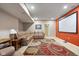 Finished basement with a cozy leather sectional sofa and a projector screen for movie nights at 15515 Alameda Pl, Westfield, IN 46074