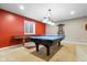 Finished basement featuring a ping pong table and a custom cue rack, ready for games at 15515 Alameda Pl, Westfield, IN 46074