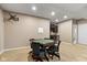 Finished basement area with a wet bar and a poker table, perfect for entertaining guests at 15515 Alameda Pl, Westfield, IN 46074