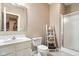 Bathroom with white vanity, toilet, and walk-in shower with a tiled floor at 15515 Alameda Pl, Westfield, IN 46074