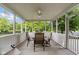 Screened in porch with a ceiling fan and outdoor seating at 15515 Alameda Pl, Westfield, IN 46074