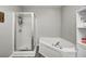 Bathroom featuring a glass enclosed shower and a deep soaking tub at 1630 Eastfork Dr, Brownsburg, IN 46112