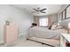 Spacious bedroom featuring an accent dresser, office nook, large bed, and neutral colors at 1630 Eastfork Dr, Brownsburg, IN 46112