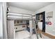 Gray loft bed and ladder over a workspace with storage leading to closet in bedroom at 1630 Eastfork Dr, Brownsburg, IN 46112