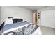 Spacious bedroom with a door to another room, a closet, and contemporary gamer decorations at 1630 Eastfork Dr, Brownsburg, IN 46112